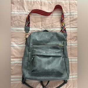Stylish Gray Backpack with Colorful Strap